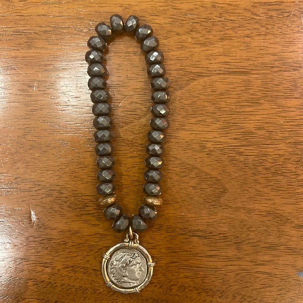 Charcoal color beaded bracelet with gold and silver coin